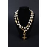 A channel faux pearl and gilt metal necklace,