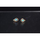 A pair of 9ct gold earrings set with turquoise and diamond