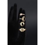Four 9ct gold rings (three as found)