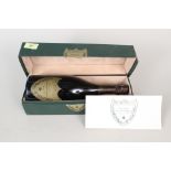 A bottle of Cuvee Dom Perignon 1985 in a presentation box (as found) with card