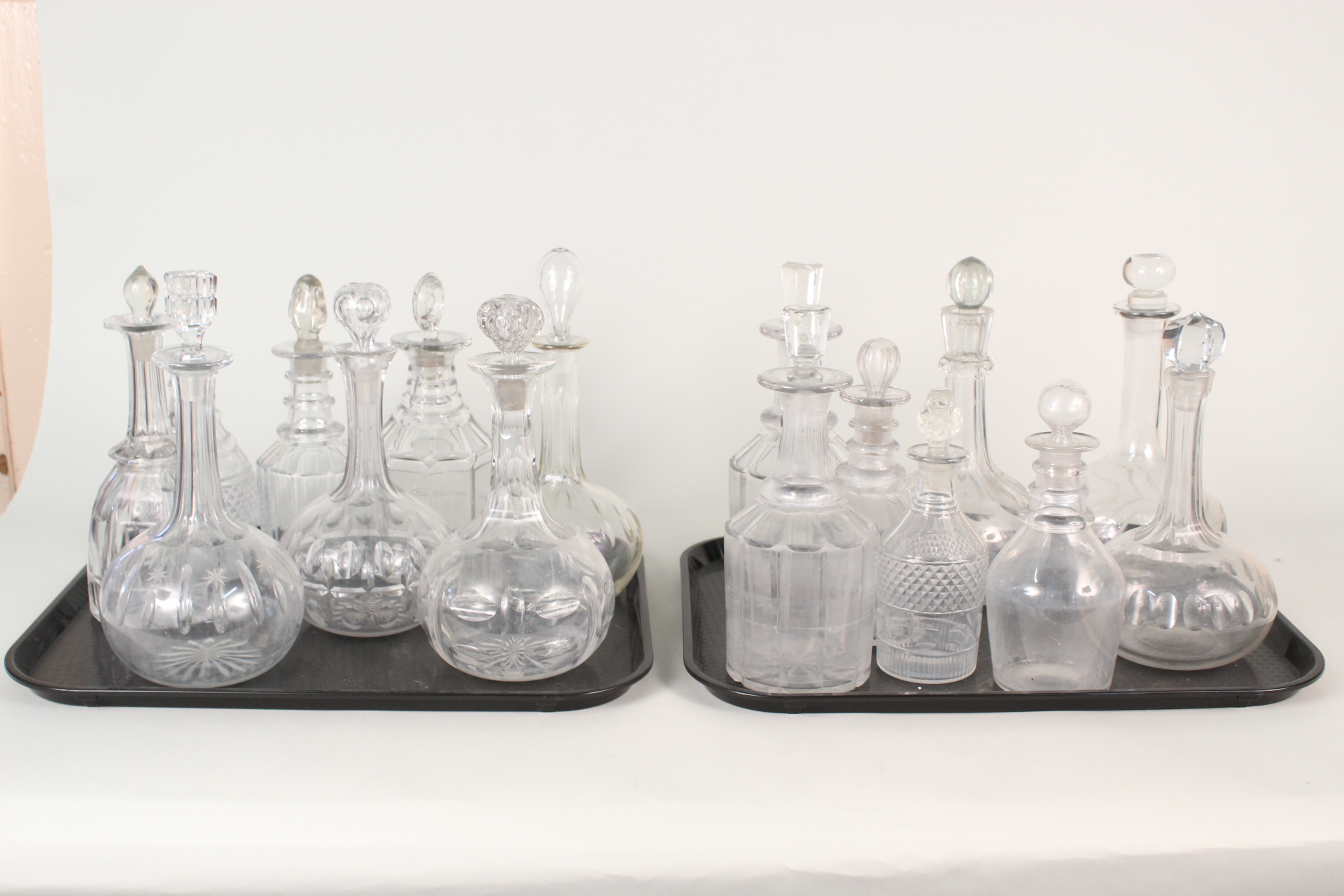 Sixteen various cut glass decanters plus thirteen various 19th Century and other glass decanters