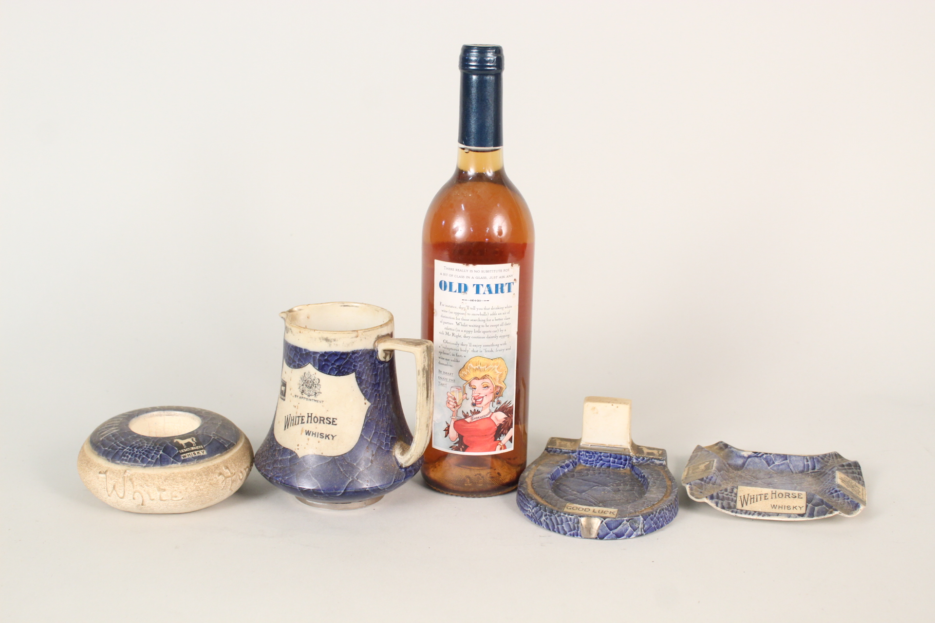 Shelley White horse whisky jug and cigarette accessories plus a bottle of 'Old Tart' French wine