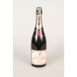 A bottle of Moet & Chandon Premiere Cuvee Champagne (purchased by owner 1971)