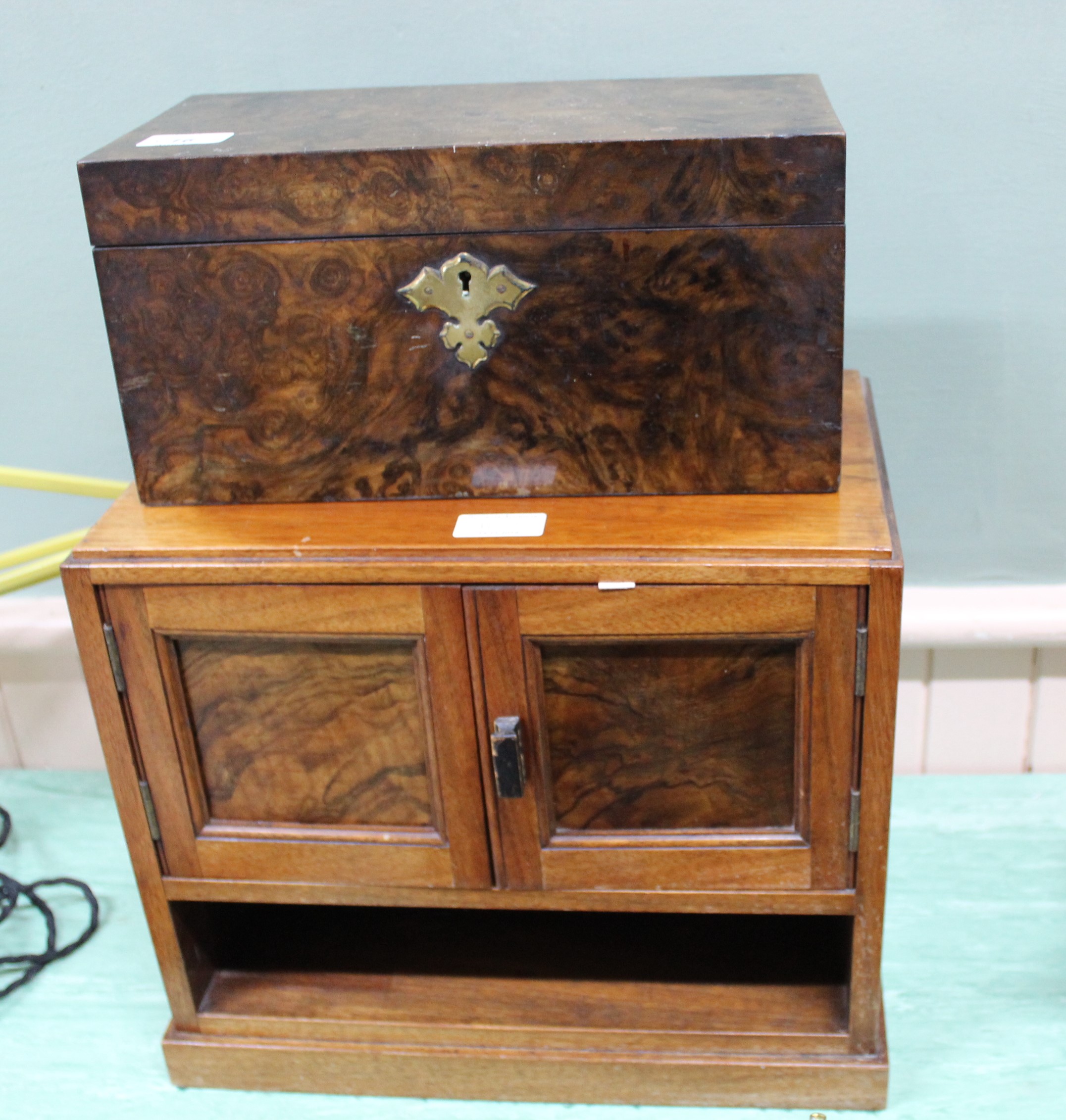 A 19th Century walnut two compartment tea caddy plus a mahogany and walnut two door table cabinet