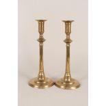 A pair of 19th Century brass candlesticks