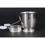 A silver christening mug and silver napkin ring