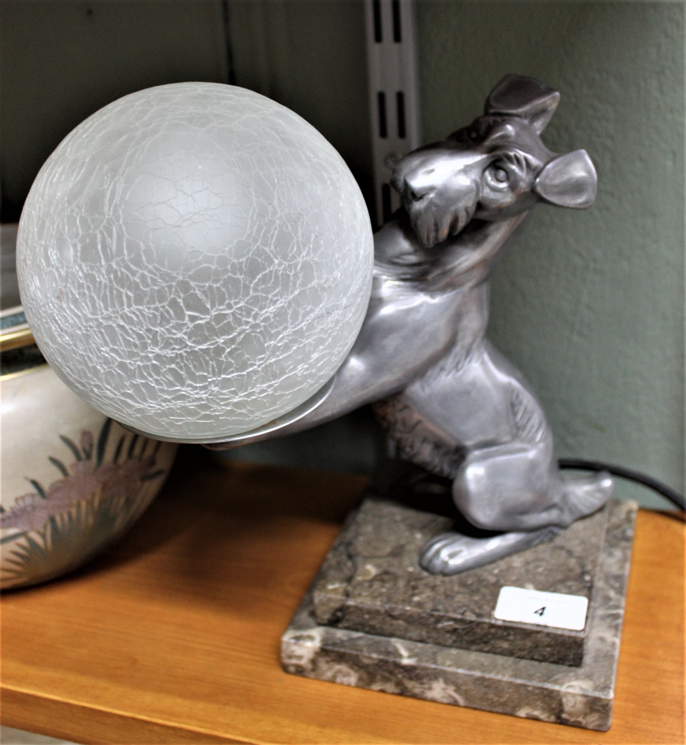 An Art Deco style metal dog table lamp on variegated marble base