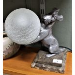 An Art Deco style metal dog table lamp on variegated marble base