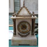 An onyx and gilt metal striking mantel clock