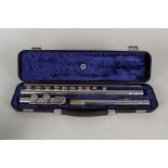 A silver plated three piece flute,