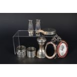 A mixed lot including silver pepper grinder, two silver napkins rings (as found),