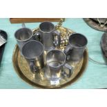 Five various pewter tankards, a Force Feed oil can, brass bell,
