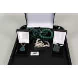 A collection of jade and other bead necklaces,
