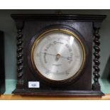 An oak aneroid barometer,