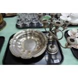 A pair of silver plated three branch candelabra and a large silver plated dish