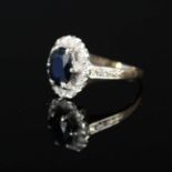 A 9ct gold sapphire and diamond cluster ring (shank is misshapen)