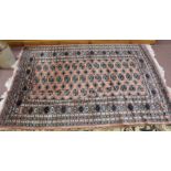 A Persian style pink ground rug,