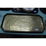 An Arts and Crafts rectangular foliate embossed brass tray,
