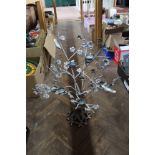 An iron tree form candle holder,
