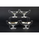 A set of four oval twin handled Georgian silver salts on pedestal bases, hallmarked London 1800,