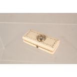 An ivory box containing a thermometer by W Elliott, London,