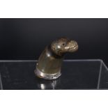 An 18th Century Scottish horn snuff mull modelled as a sea lion with white metal mounts and