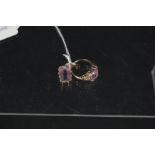 A 9ct gold amethyst set ring with floral decorated shoulders,