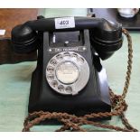 A vintage black Bakelite telephone plus a gilt framed print of a sea battle