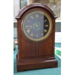 A mahogany striking mantel clock with malachite central dial,