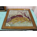 A maple framed wool work picture of a tiger,