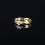 A 22ct ring set with single white stone,