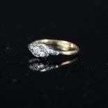 An 18ct gold and platinum illusion set three stone diamond ring,