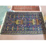 A blue ground Afghan rug,