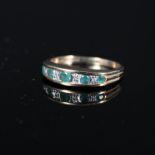 A 9ct gold diamond and emerald set ring,
