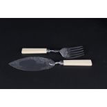 A pair of silver fish servers with engraved decoration, ivorine handles by Joseph Rodgers,