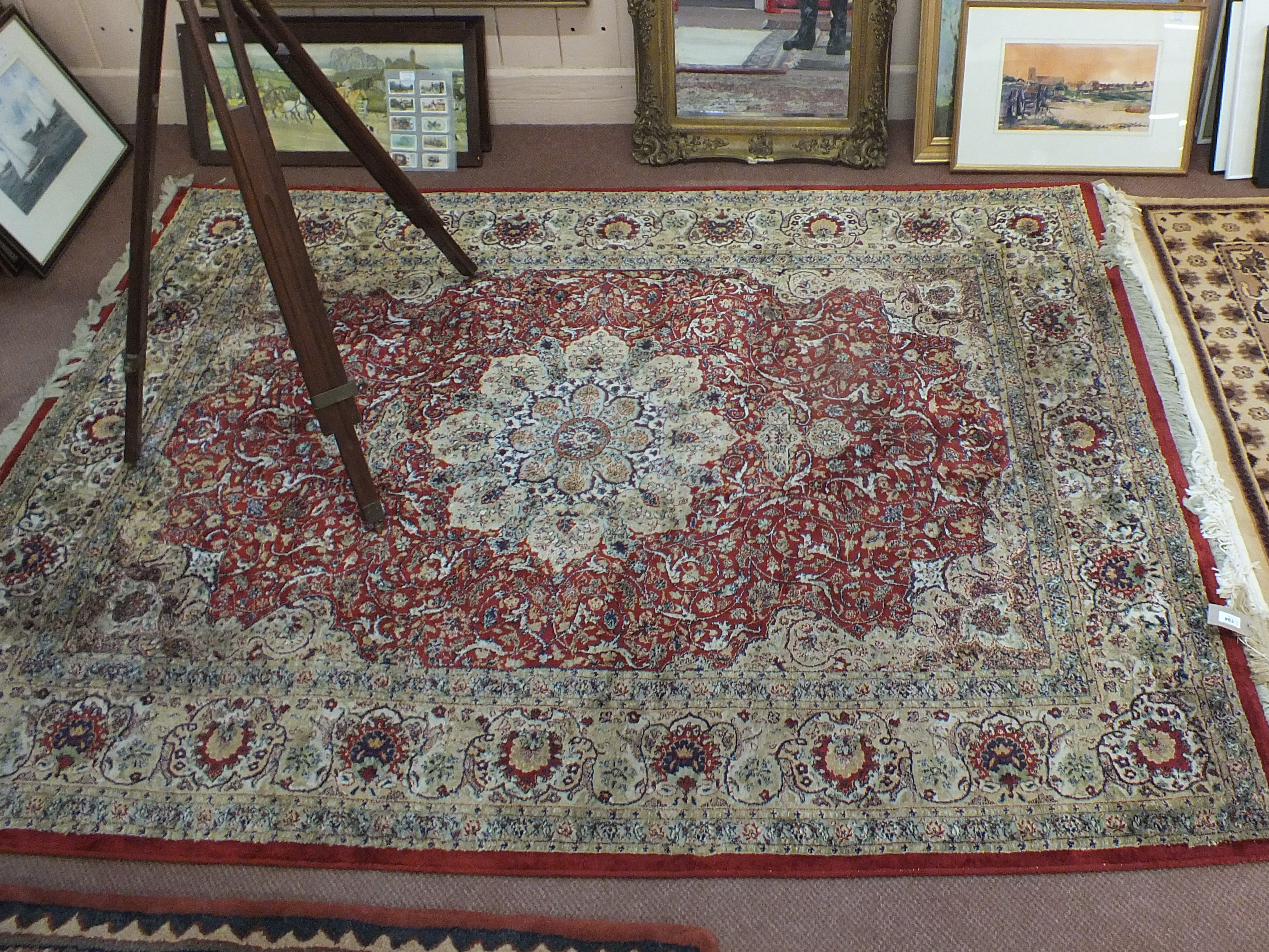 A machine made Persian pattern floral carpet,