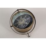 A brass gymbal ships compass by C R Sherman & Co,