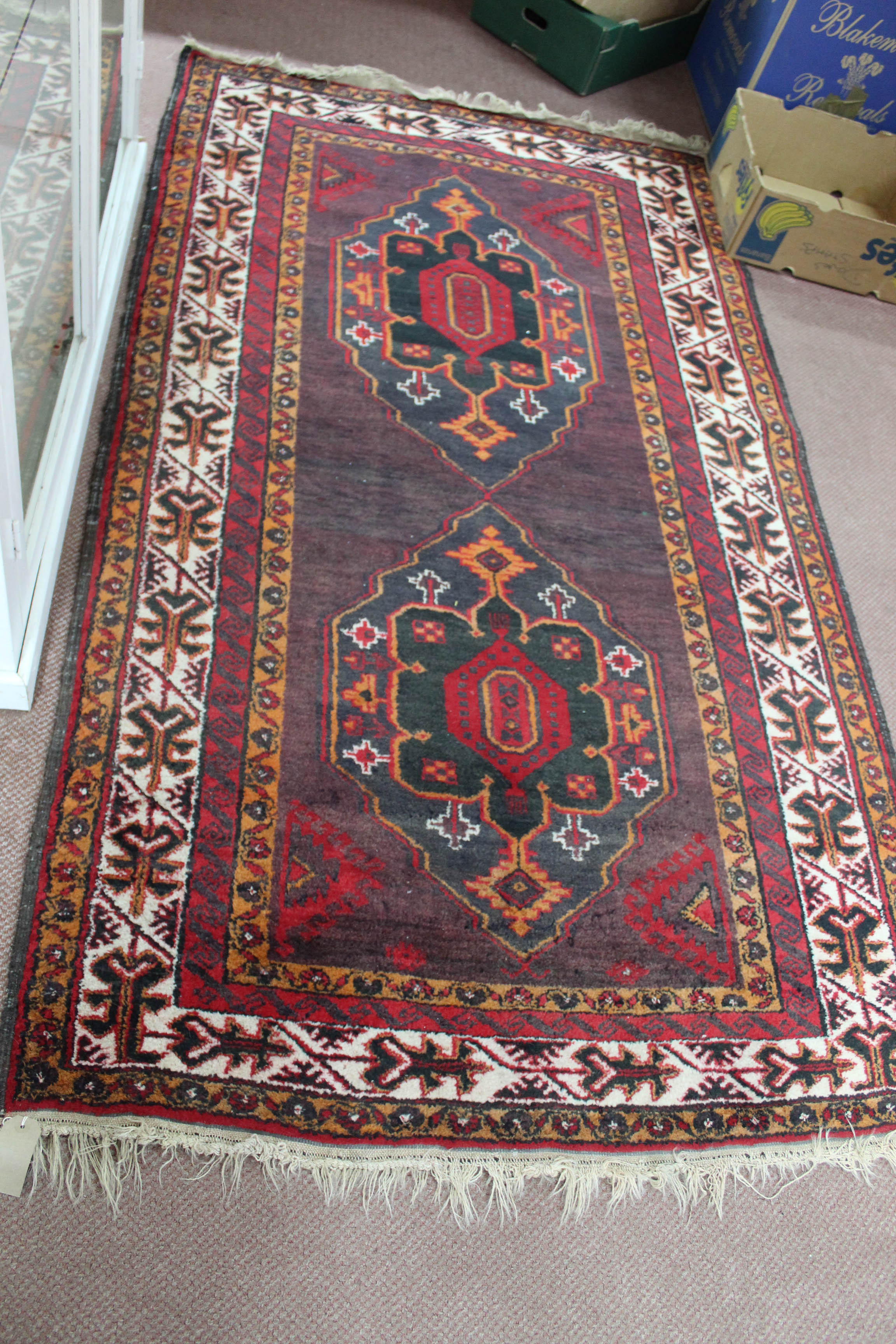 A red ground Afghan rug,