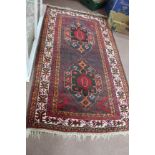 A red ground Afghan rug,
