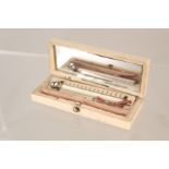 An ivory box containing a thermometer by L Runchetti,