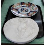 A 19th Century Imari dish plus a plaster relief cherub plaque