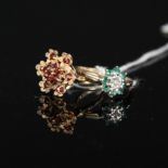 A 9ct gold garnet set floral style ring and a 9ct gold emerald and diamond floral cluster ring