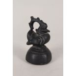 A Burmese cast bronze opium weight in the form of a mythological bird,