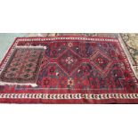 A Persian red ground geometric rug plus a pink ground prayer mat