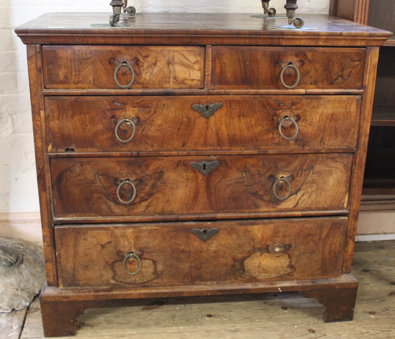 An 18th Century walnut veneer chest of five drawers