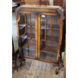 A 1940's two door china display cabinet on cabriole legs