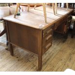 A 1940's utility desk with six drawers