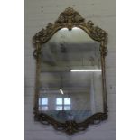 A large ornate modern gilt Rococo style wall mirror