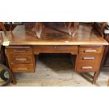 A 1940's utility desk with six drawers,