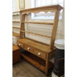 A late Victorian three door kitchen dresser with open back top